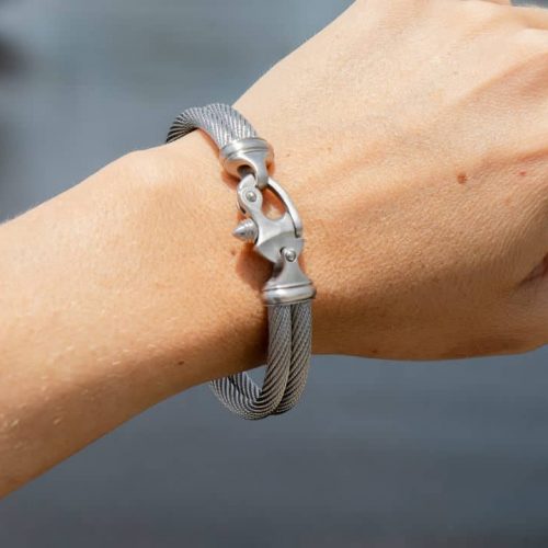 Silver Bracelet A womans hand wearing a bracelet