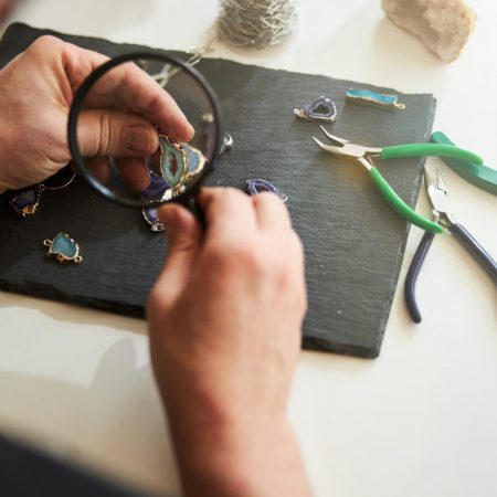 jeweler-checking-the-quality-of-his-new-jewelry-it-2024-10-18-08-39-51-utc-w1080-h1920 A jeweler creating a bracelet